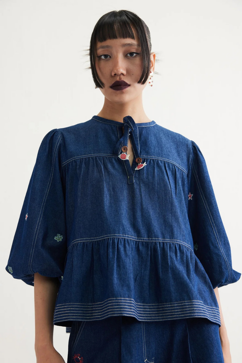 Deep Sea Sustainable Denim Peplum Top cotton by SUI in blue color for women Worldwide