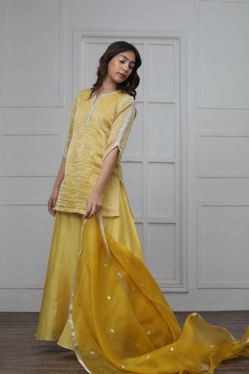 Banarsi Zari Stripe Kathiawadi Embroidered V yoke Kurta with Solid pants and Butti dupatta Kurta Sets by Myoho in yellow color for women Worldwide
