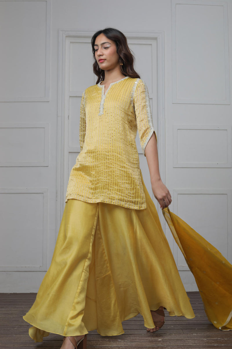 Banarsi Zari Stripe Kathiawadi Embroidered V yoke Kurta with Solid pants and Butti dupatta Kurta Sets by Myoho in yellow color for women Worldwide