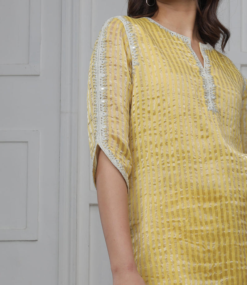 Banarsi Zari Stripe Kathiawadi Embroidered V yoke Kurta with Solid pants and Butti dupatta Kurta Sets by Myoho in yellow color for women Worldwide
