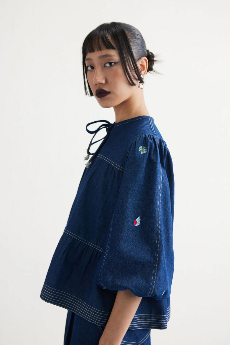 Deep Sea Sustainable Denim Peplum Top cotton by SUI in blue color for women Worldwide