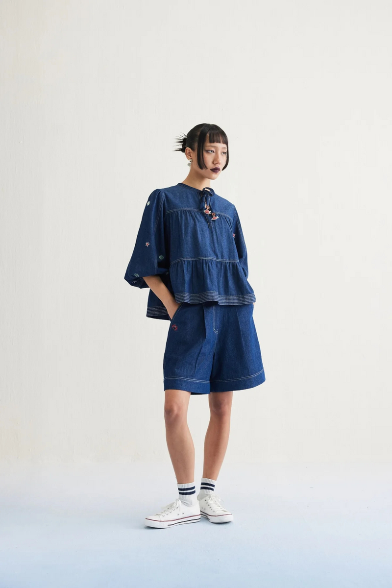 Deep Sea Sustainable Denim Peplum Top cotton by SUI in blue color for women Worldwide