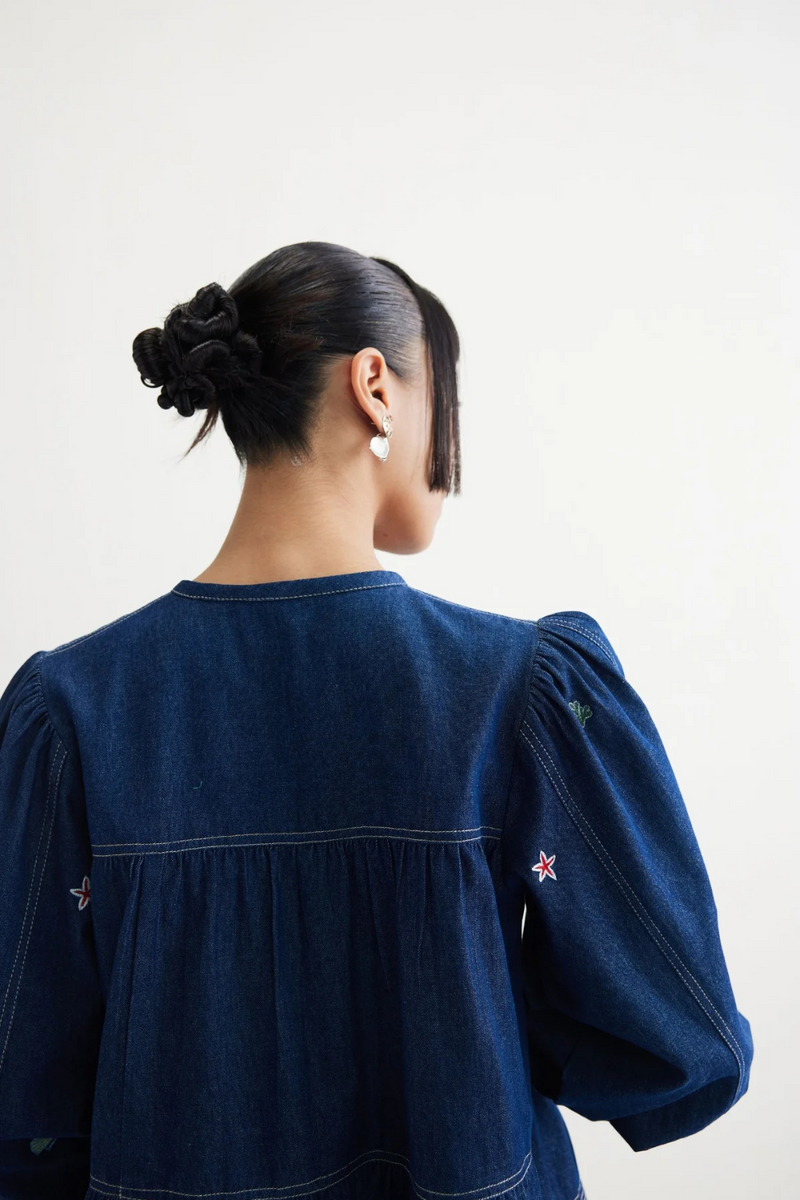 Deep Sea Sustainable Denim Peplum Top cotton by SUI in blue color for women Worldwide
