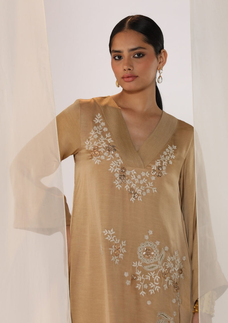 Linen satin v neck kurta with scatter embroidery satin by Myoho in beige color for women Worldwide