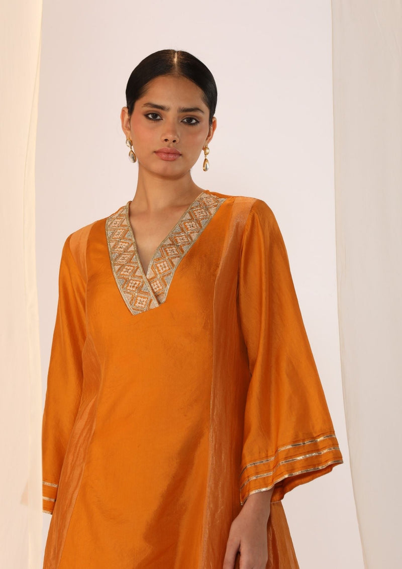 Double-layer kurta with handwork on neckline paired with pants silk by Myoho in orange color for women Worldwide