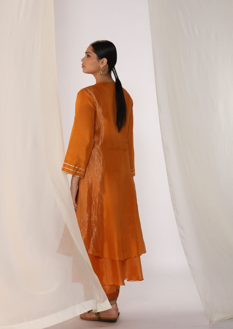 Double-layer kurta with handwork on neckline paired with pants silk by Myoho in orange color for women Worldwide