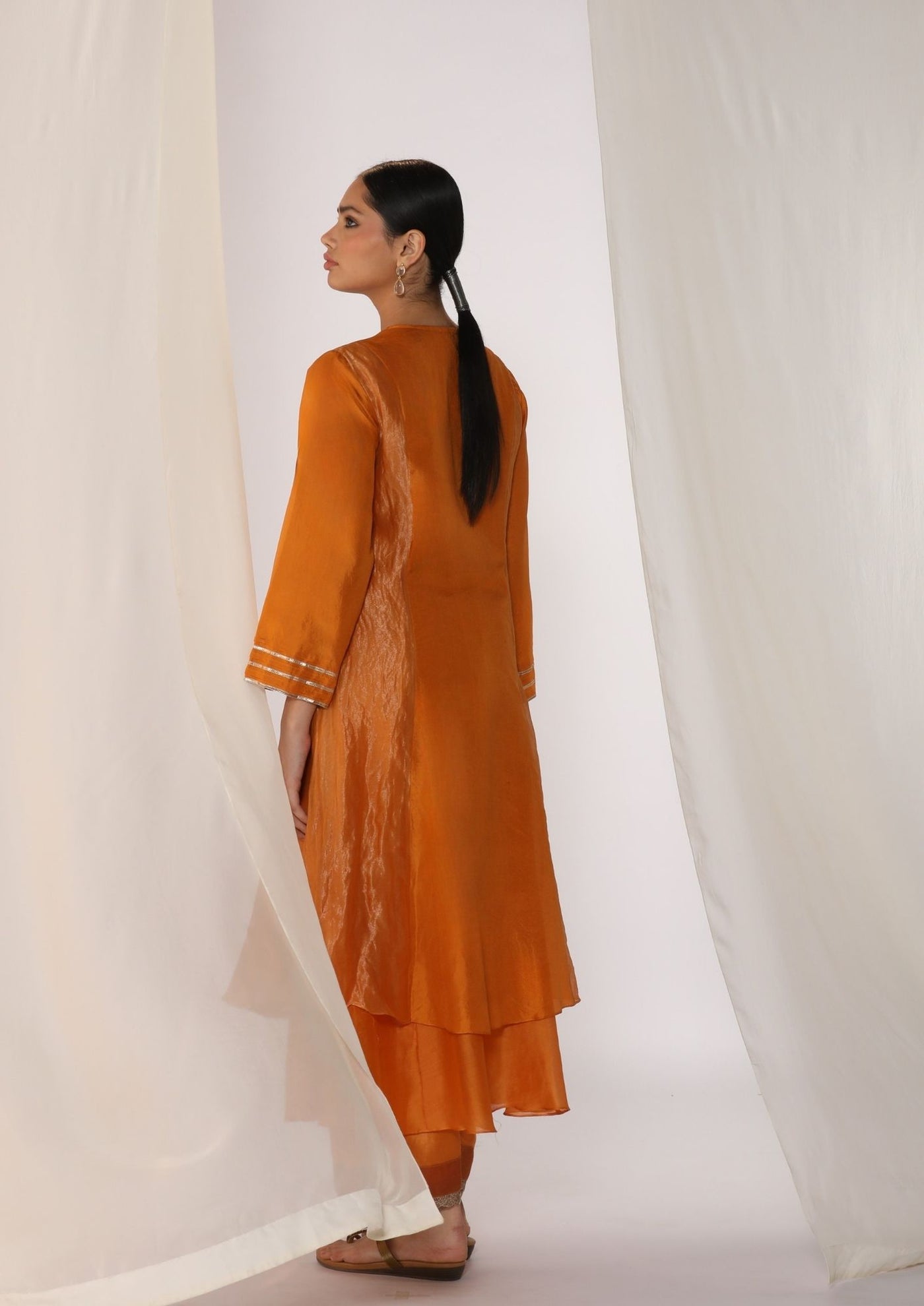 Double-layer kurta with handwork on neckline paired with pants