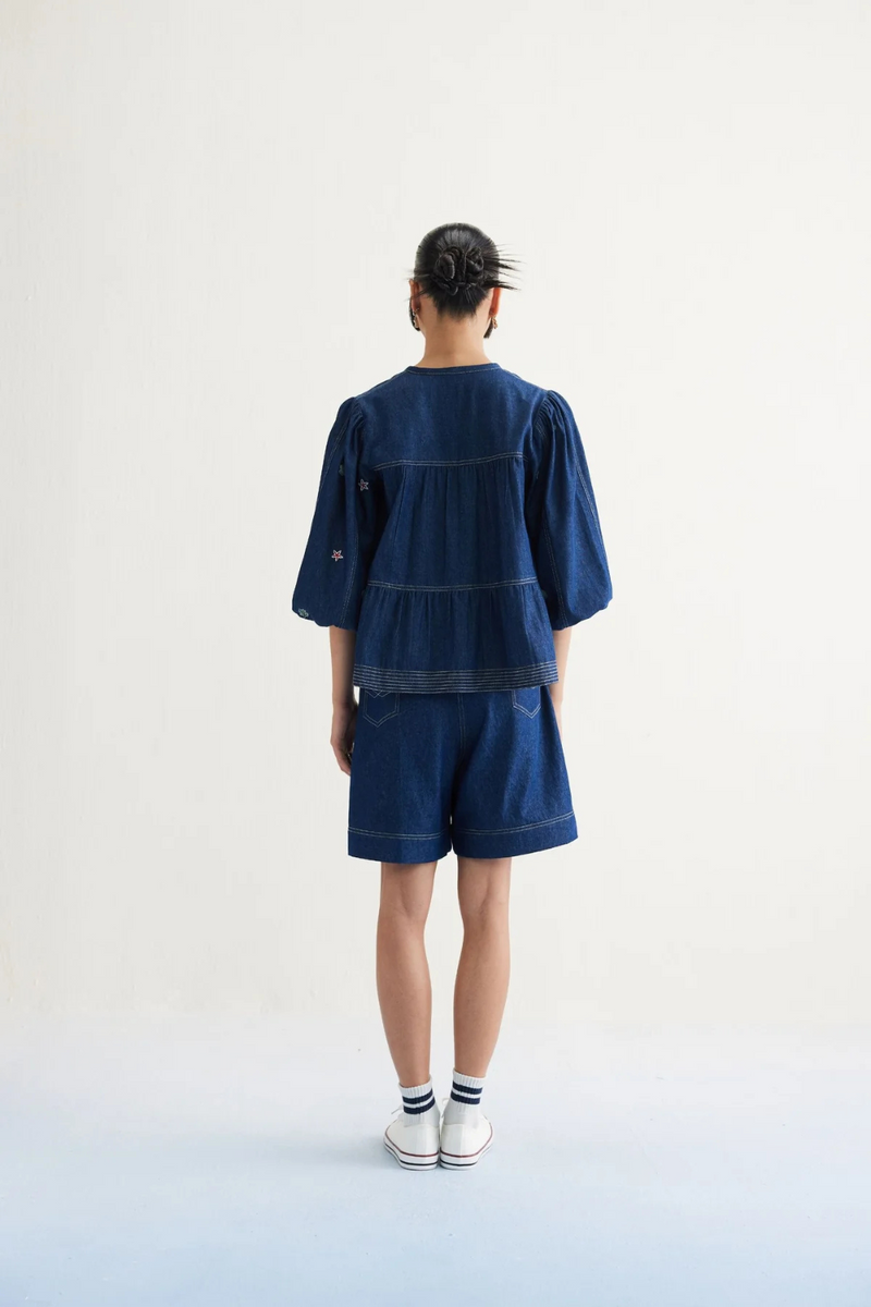 Deep Sea Sustainable Denim Peplum Top cotton by SUI in blue color for women Worldwide