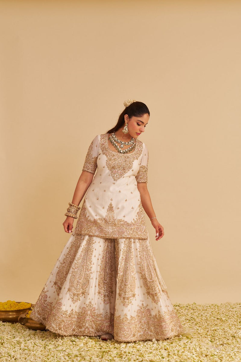 Alina - Dabka Zardozi Embroidered Silk Daisy Ivory Sharara Set silk by SHEETAL BATRA in ivory color for women Worldwide