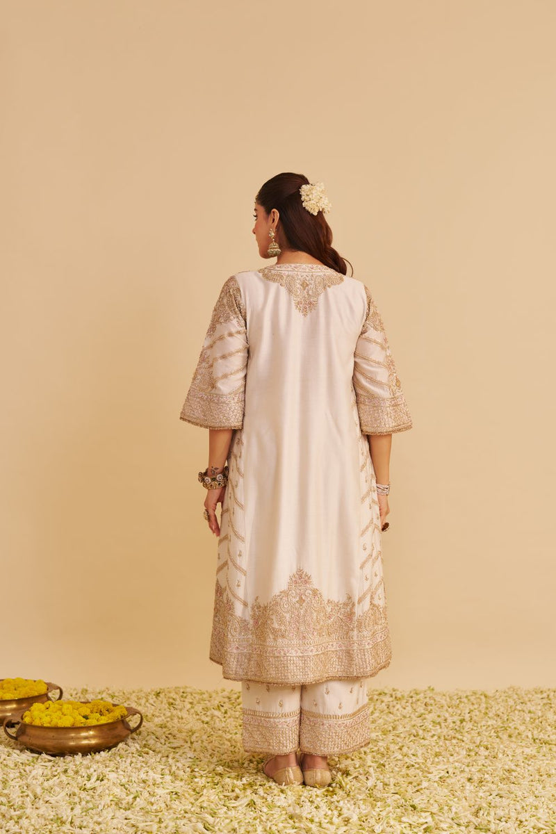 Aqsha - Dabka Zardozi Embroidered Rich Banarasi Daisy Ivory Long Chauga & Palazzo with Dupatta silk by SHEETAL BATRA in ivory color for women Worldwide