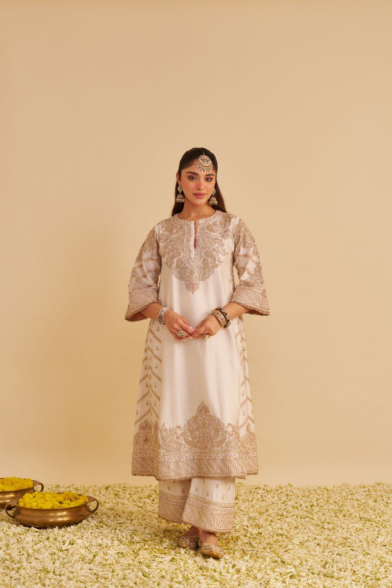 Aqsha - Dabka Zardozi Embroidered Rich Banarasi Daisy Ivory Long Chauga & Palazzo silk by SHEETAL BATRA in ivory color for women Worldwide