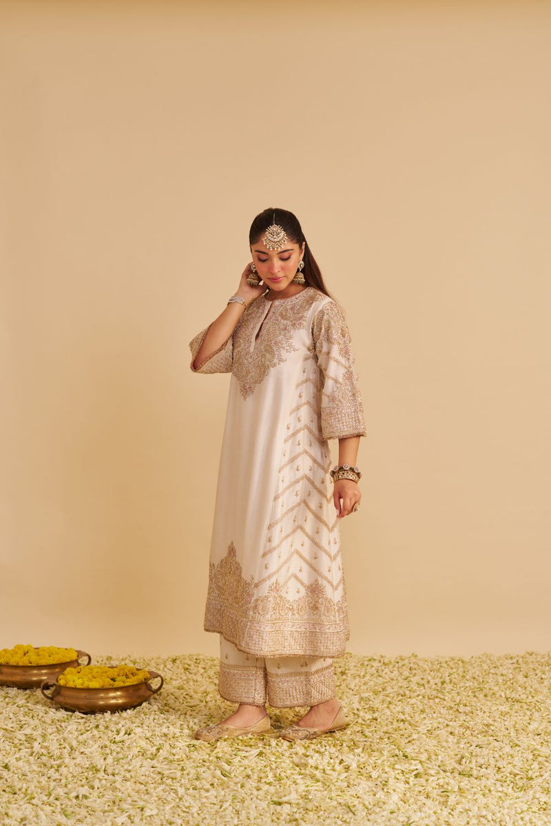 Aqsha - Dabka Zardozi Embroidered Rich Banarasi Daisy Ivory Long Chauga & Palazzo with Dupatta silk by SHEETAL BATRA in ivory color for women Worldwide