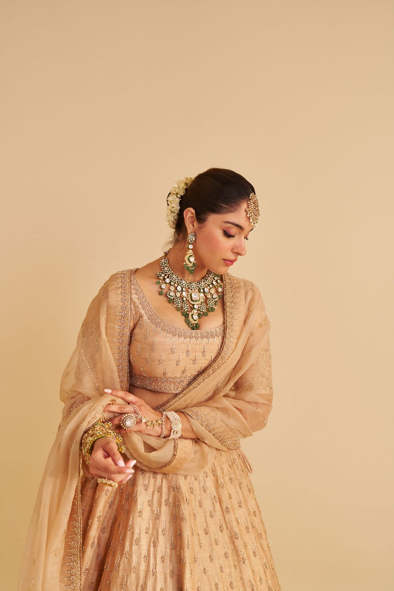 Aaliya - Dabka Zardozi Embroidered Raw Silk Gold Lehenga Set silk by SHEETAL BATRA in gold color for women Worldwide