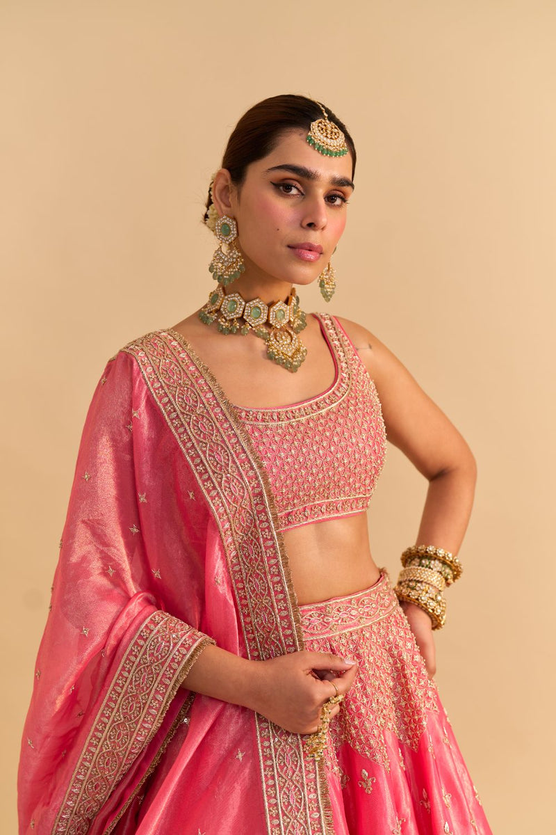 Aashina - Dabka Zardozi Embroidered Pure Tissue Carrot Pink Lehenga Set by SHEETAL BATRA in pink color for women Worldwide