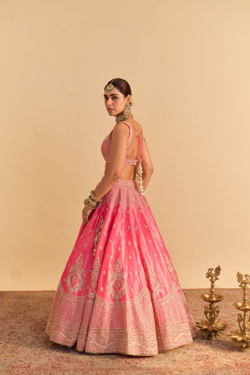 Aashina - Dabka Zardozi Embroidered Pure Tissue Carrot Pink Lehenga Set by SHEETAL BATRA in pink color for women Worldwide