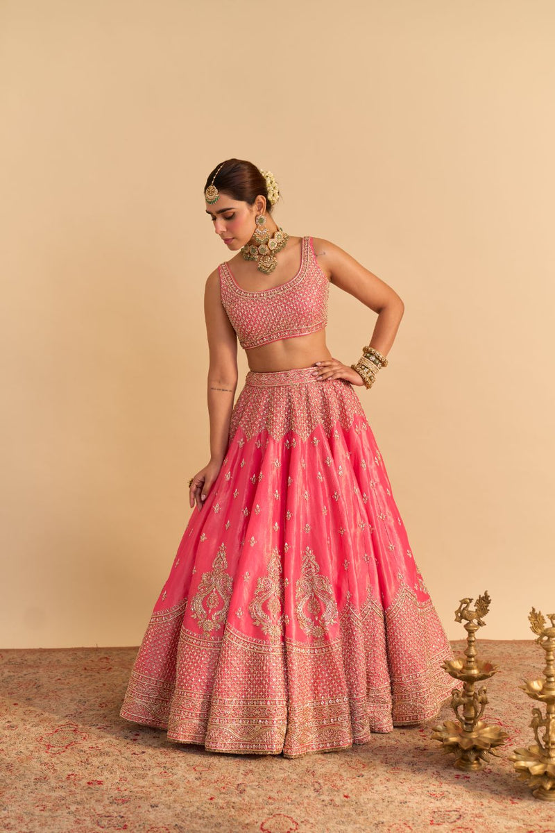 Aashina - Dabka Zardozi Embroidered Pure Tissue Carrot Pink Lehenga Set by SHEETAL BATRA in pink color for women Worldwide