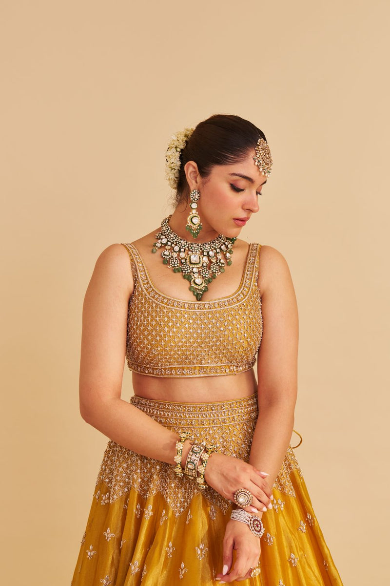 Aashina - Dabka Zardozi Embroidered Pure Tissue Mustard Lehenga Set silk by SHEETAL BATRA in gold color for women Worldwide
