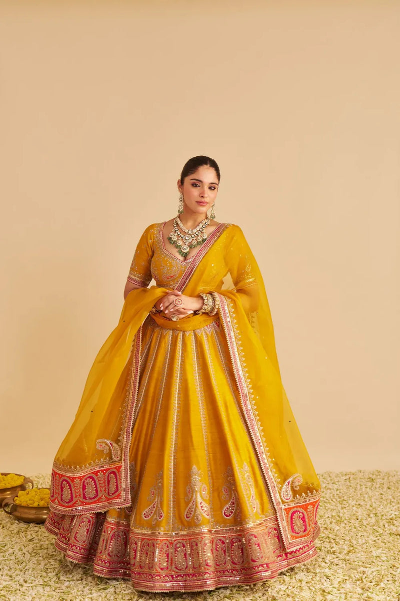 Amara - Hand Embroidered Raw Silk Mustard Bridal Lehenga Set silk by SHEETAL BATRA in mustard color for women Worldwide