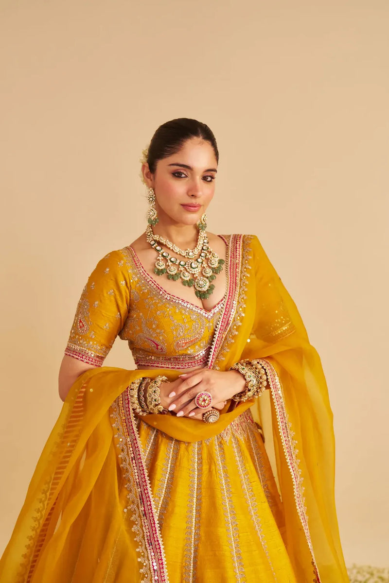 Amara - Hand Embroidered Raw Silk Mustard Bridal Lehenga Set silk by SHEETAL BATRA in mustard color for women Worldwide