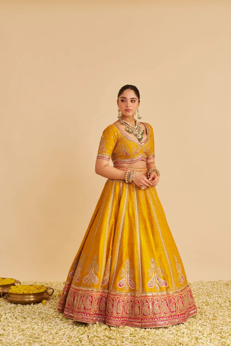 Amara - Hand Embroidered Raw Silk Mustard Bridal Lehenga Set silk by SHEETAL BATRA in mustard color for women Worldwide