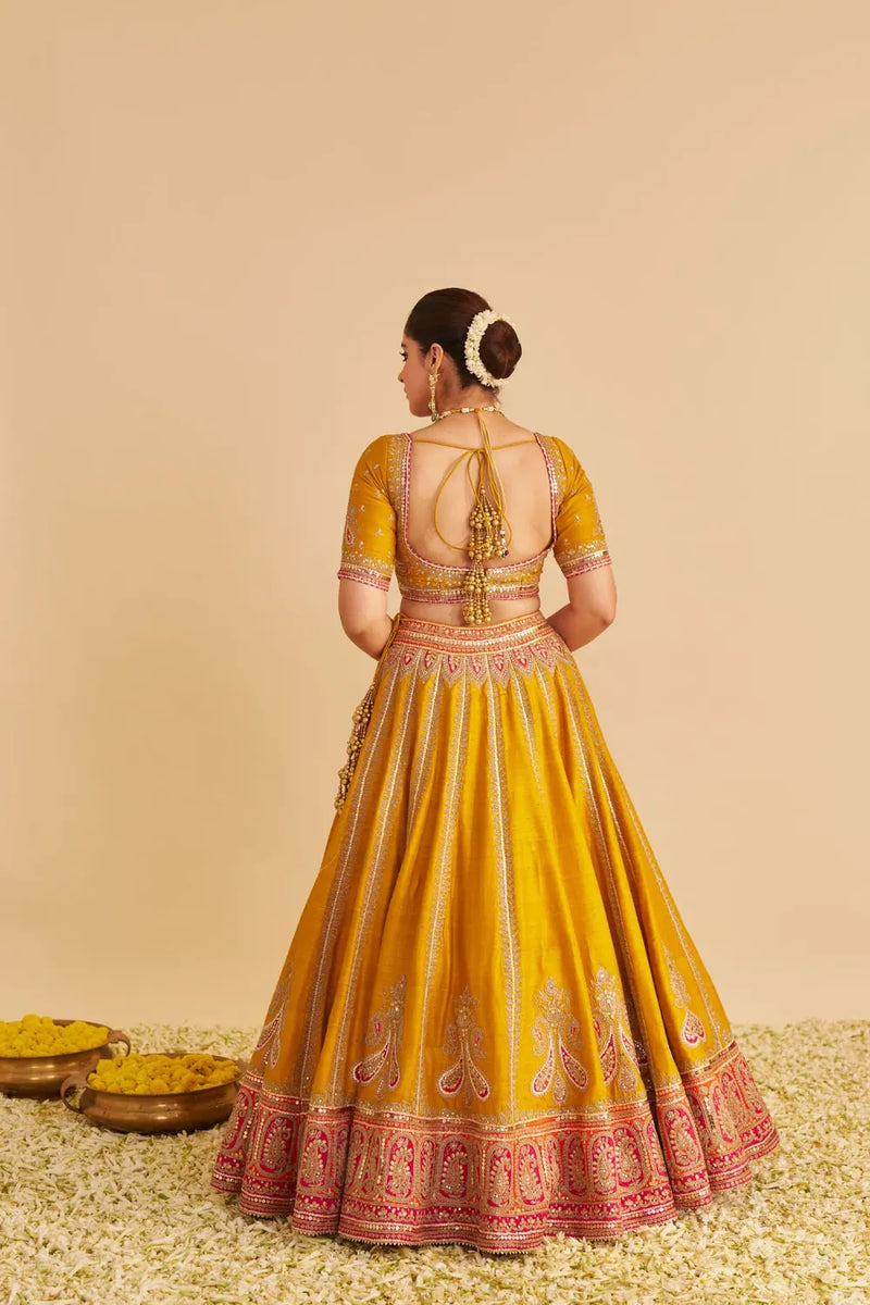 Amara - Hand Embroidered Raw Silk Mustard Bridal Lehenga Set silk by SHEETAL BATRA in mustard color for women Worldwide
