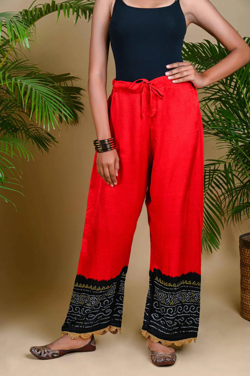 BANDHANI PANTS-BLACK & RED silk by Dyelogue in red color for women Worldwide