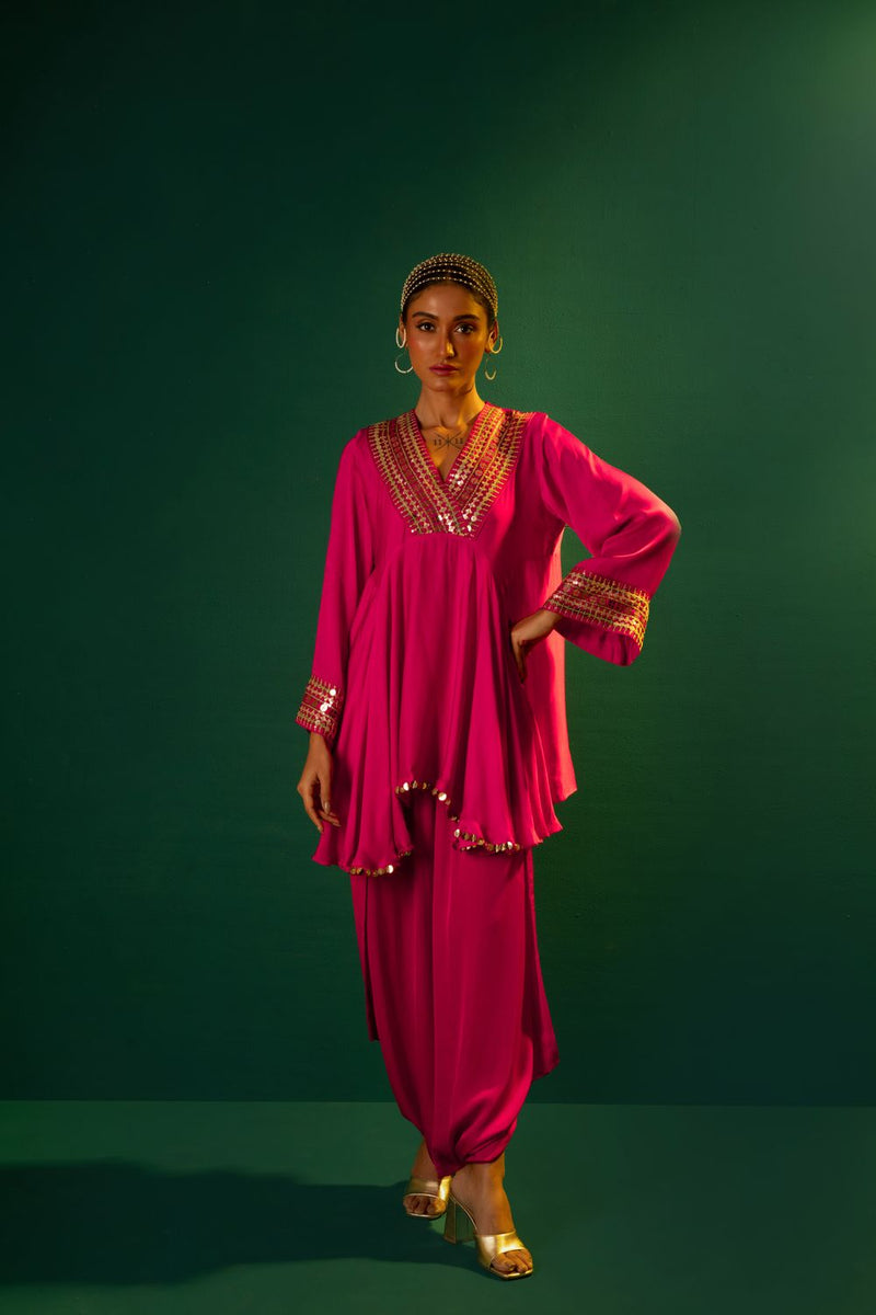 Chamakeen Ariyana Fuscia Asymmetrical Tunic with Dhoti Skirt satin by PRAHNAAYA in pink color for women Worldwide