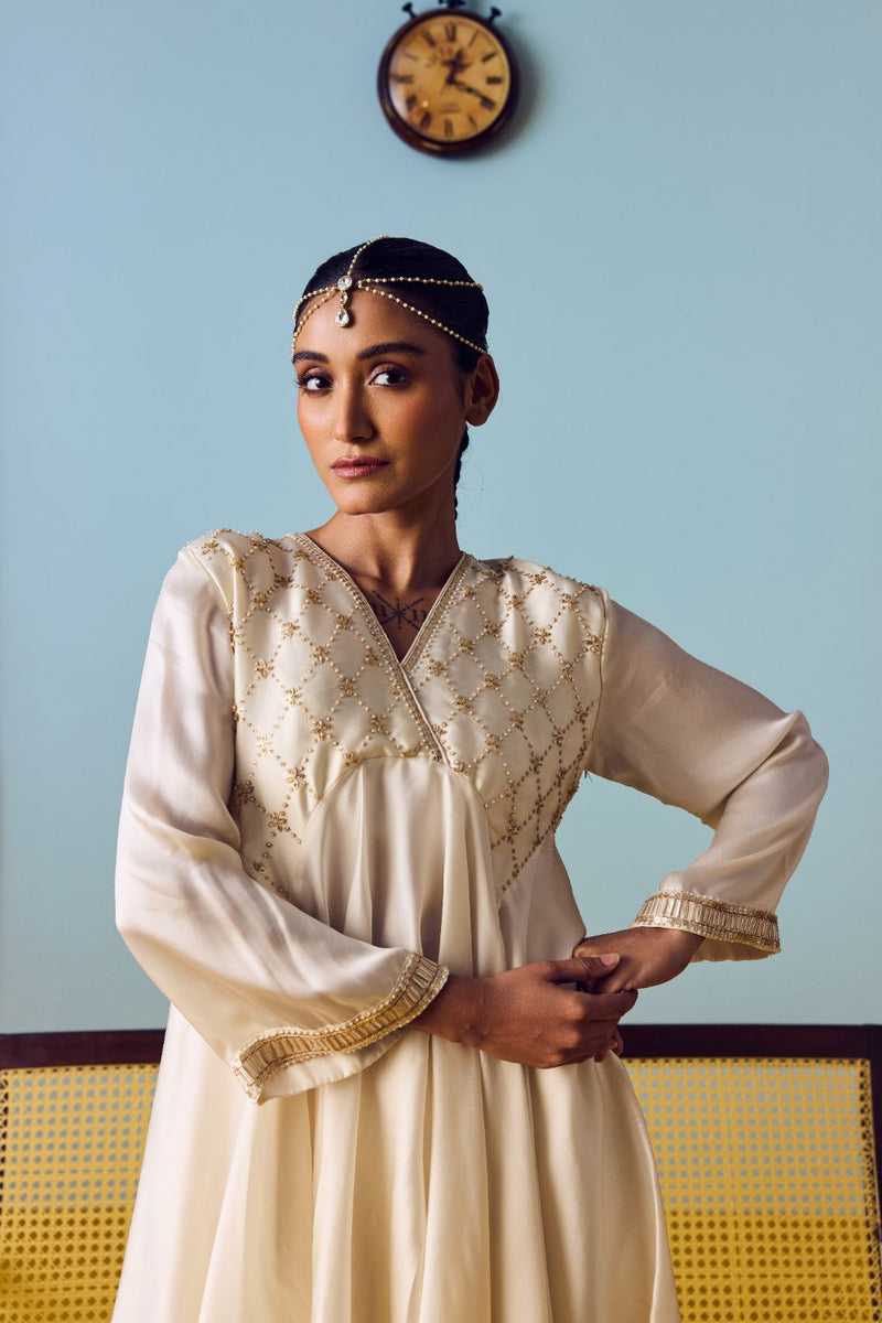 Sureen Pearl Asymmetric Flared Top & Skirt Set satin by PRAHNAAYA in white color for women Worldwide