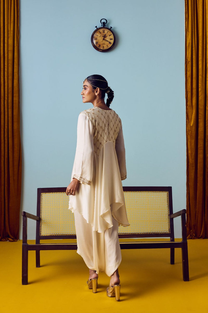 Sureen Pearl Asymmetric Flared Top & Skirt Set satin by PRAHNAAYA in white color for women Worldwide