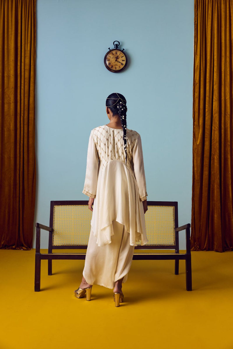 Sureen Pearl Asymmetric Flared Top & Skirt Set satin by PRAHNAAYA in white color for women Worldwide