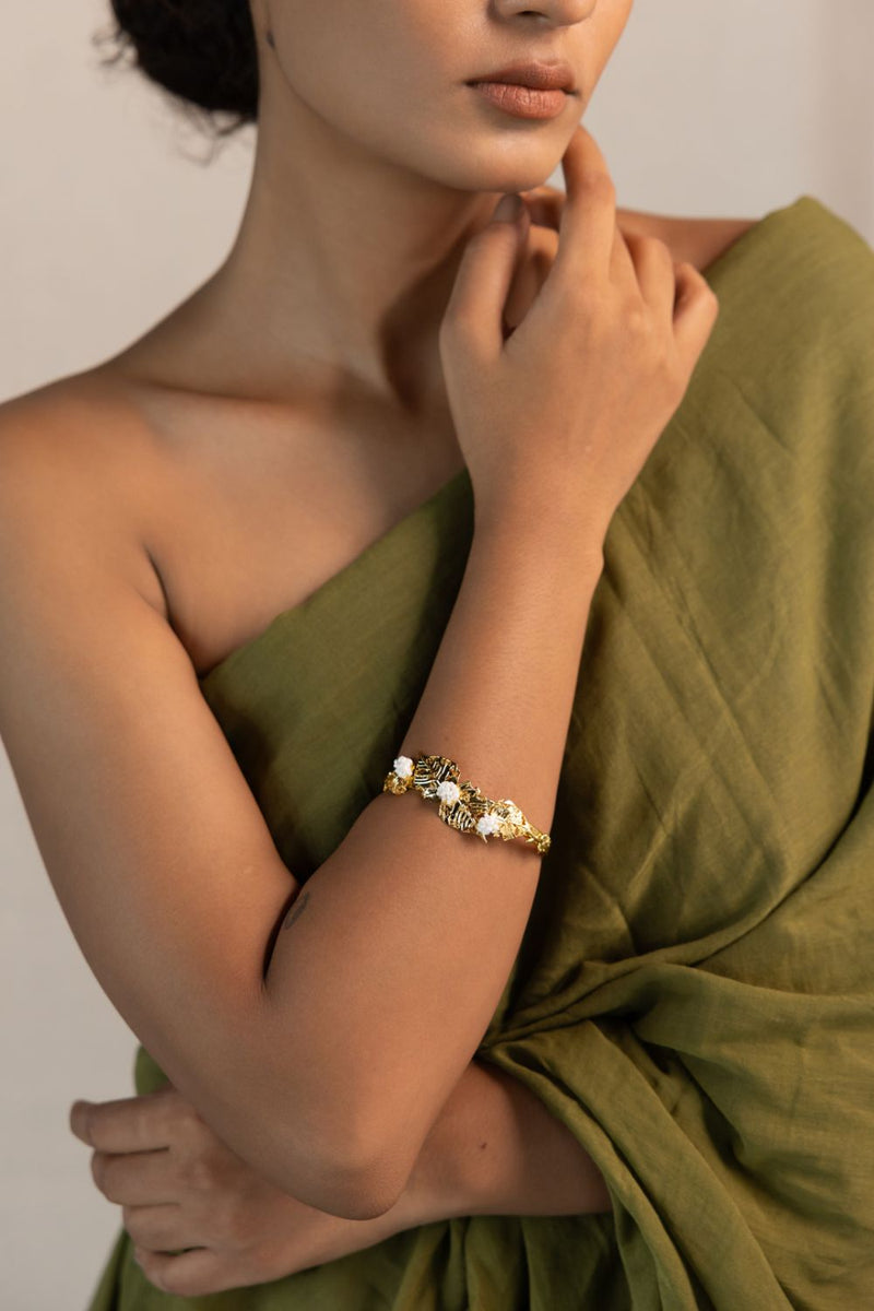 Pushpi kada 18k gold plated on brass bangle and bracelet by Aarjavee in gold for women Worldwide