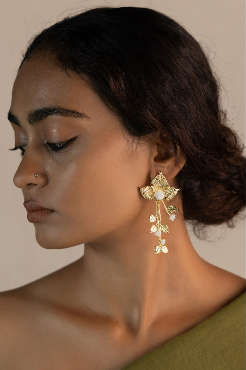 Chhayaa Butti 18k gold plated on brass earring by Aarjavee in gold for women Worldwide
