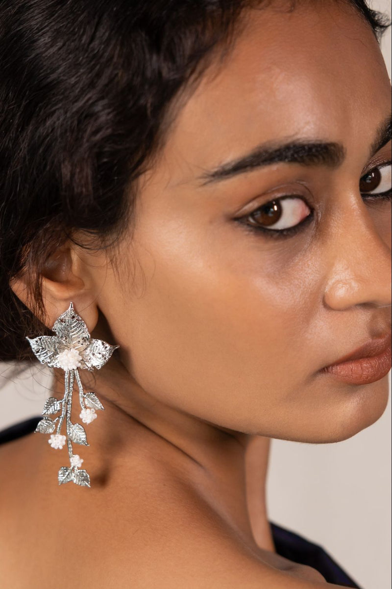 Chhayaa Butti 18k gold plated on brass earring by Aarjavee in gold for women Worldwide