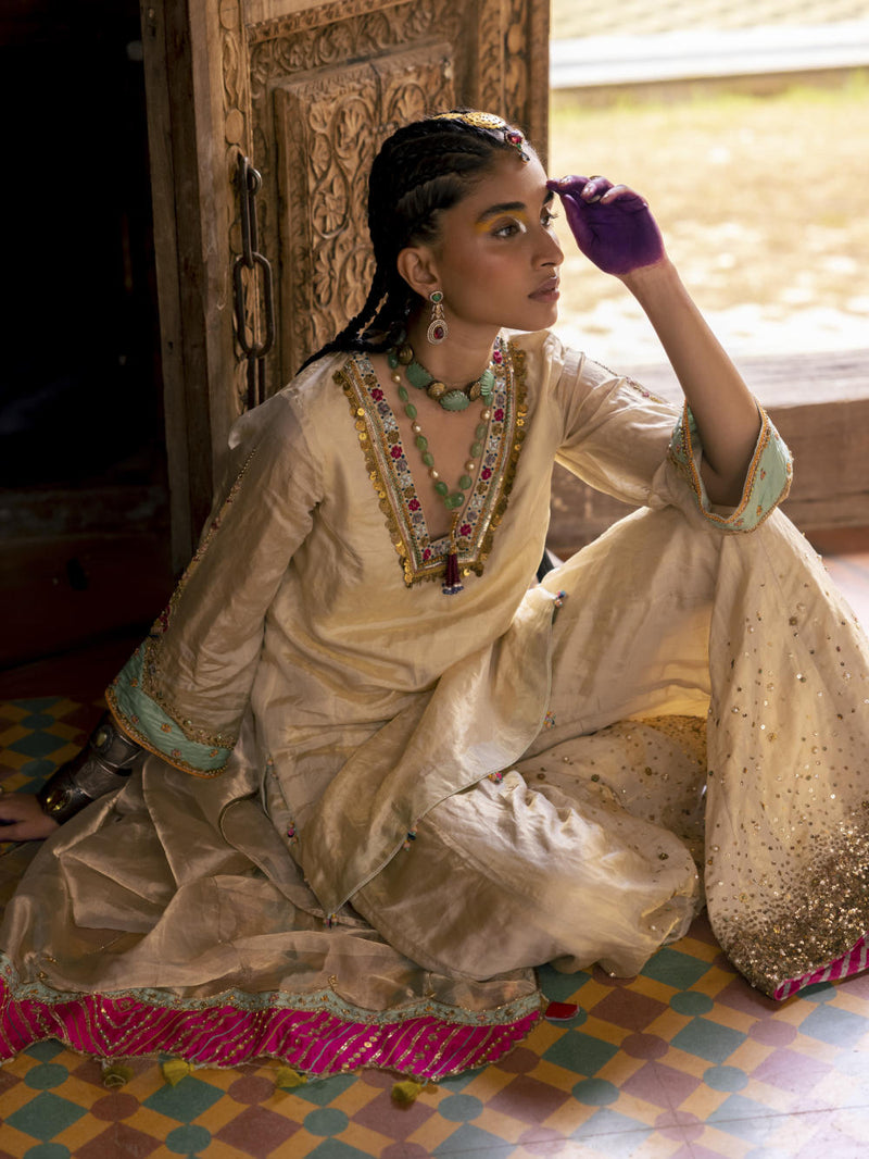 Fariba Ivory Golden Tissue Sharara Set Kurta Sets by Rajiramniq for women Worldwide
