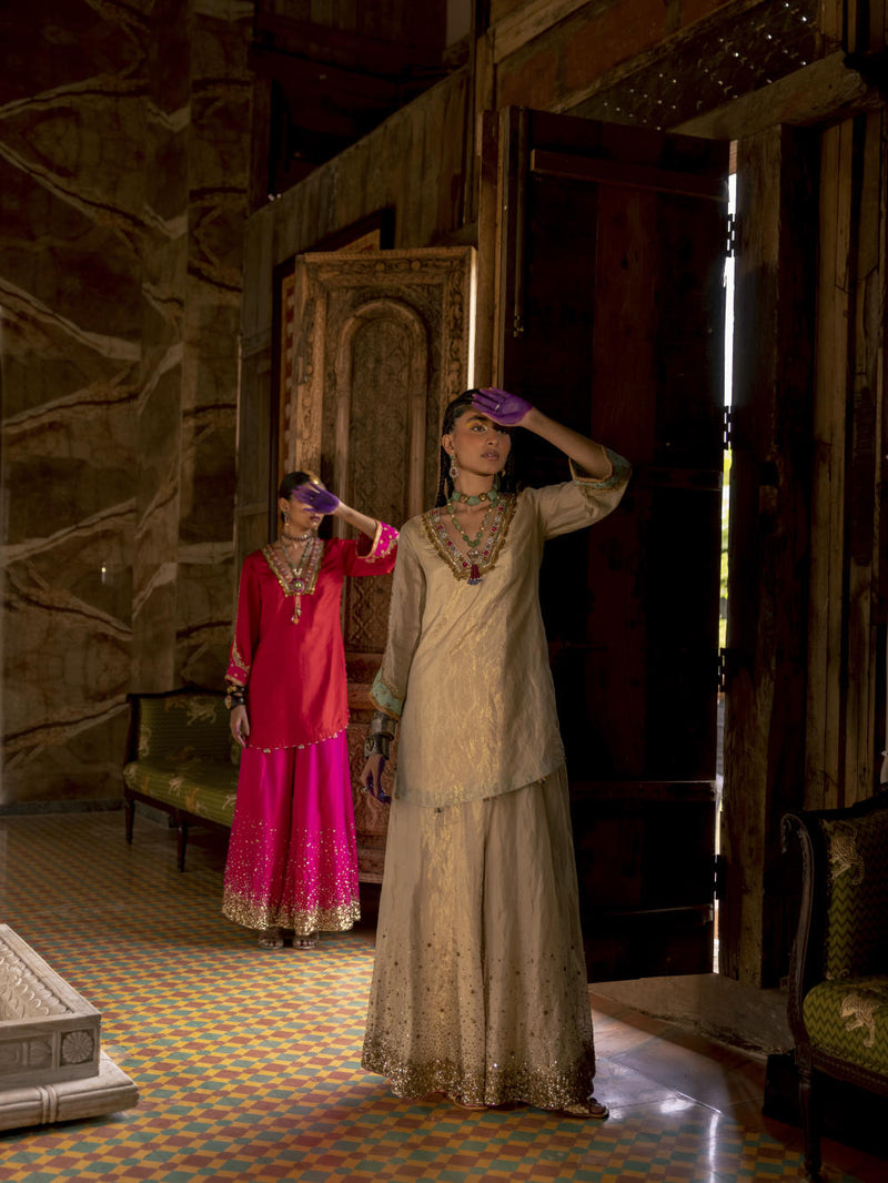 Fariba Ivory Golden Tissue Sharara Set Kurta Sets by Rajiramniq for women Worldwide