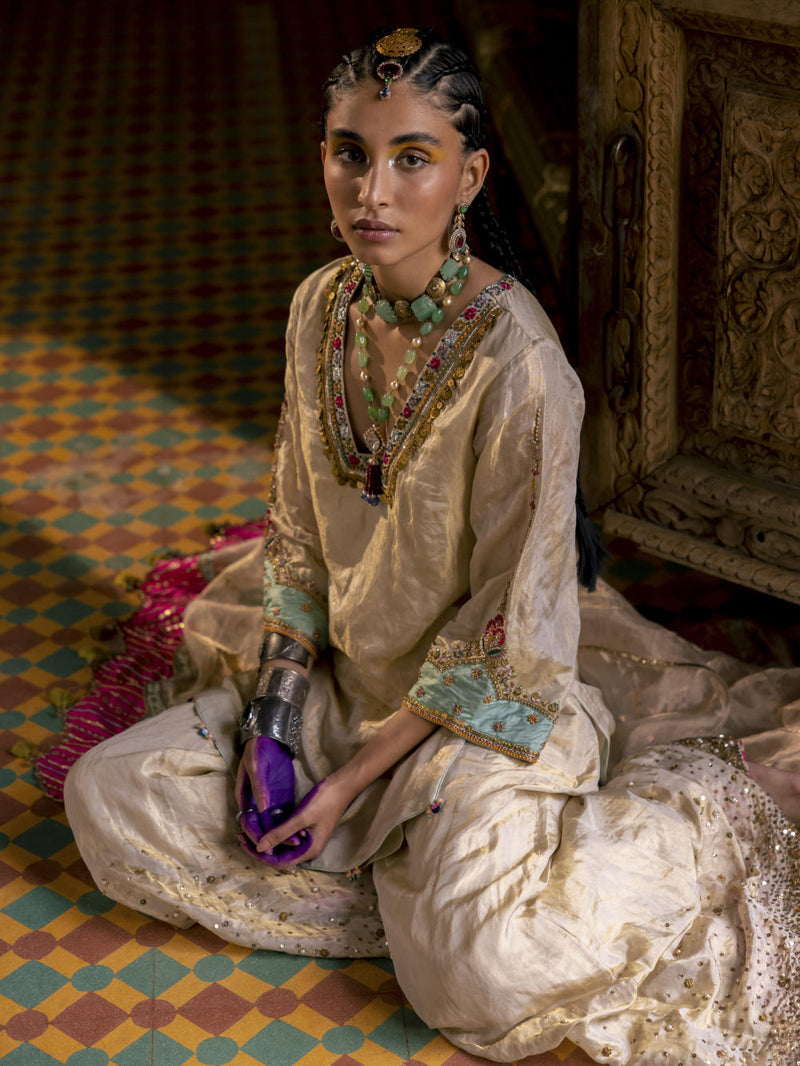 Fariba Ivory Golden Tissue Sharara Set Kurta Sets by Rajiramniq for women Worldwide
