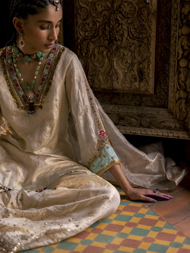 Fariba Ivory Golden Tissue Sharara Set Kurta Sets by Rajiramniq for women Worldwide