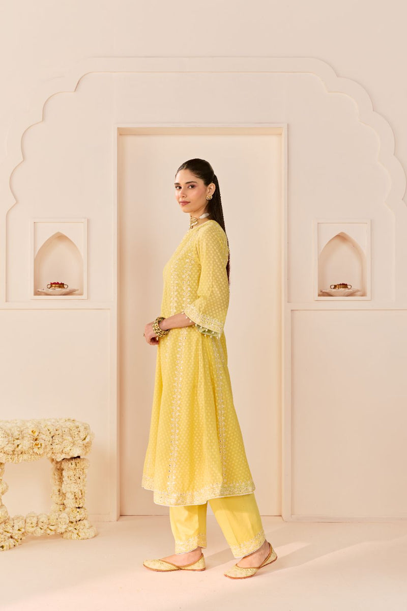 FIRDAUS -LEMON YELLOW LONG KALIDAAR CHAUGA WITH DOGRI SALWAR AND DUPATTA chanderi silk kurta/kurta set by SHEETAL BATRA in lemon yellow with mint green for women Worldwide