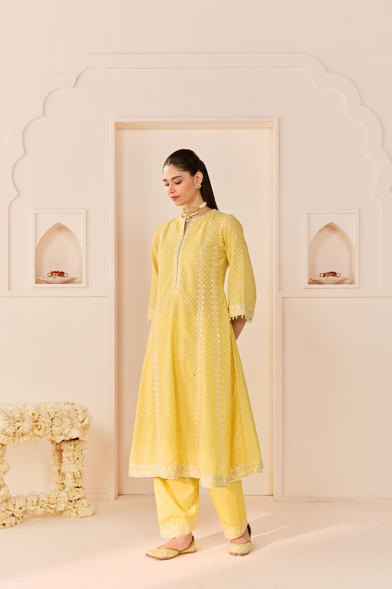 FIRDAUS -LEMON YELLOW LONG KALIDAAR CHAUGA WITH DOGRI SALWAR AND DUPATTA chanderi silk kurta/kurta set by SHEETAL BATRA in lemon yellow with mint green for women Worldwide