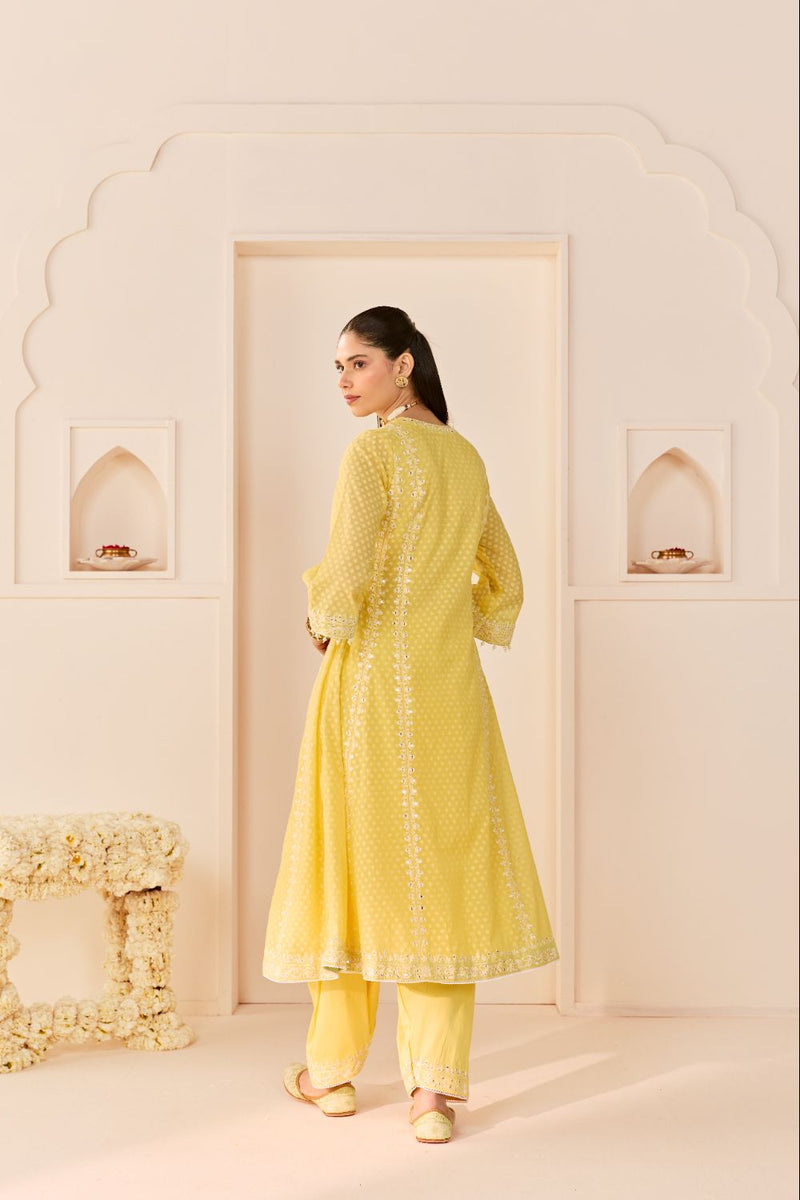 FIRDAUS -LEMON YELLOW LONG KALIDAAR CHAUGA WITH DOGRI SALWAR AND DUPATTA chanderi silk kurta/kurta set by SHEETAL BATRA in lemon yellow with mint green for women Worldwide