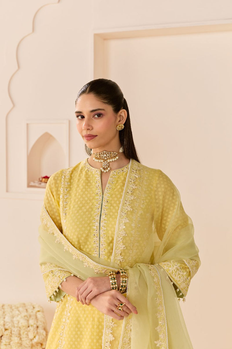 FIRDAUS -LEMON YELLOW LONG KALIDAAR CHAUGA WITH DOGRI SALWAR AND DUPATTA chanderi silk kurta/kurta set by SHEETAL BATRA in lemon yellow with mint green for women Worldwide