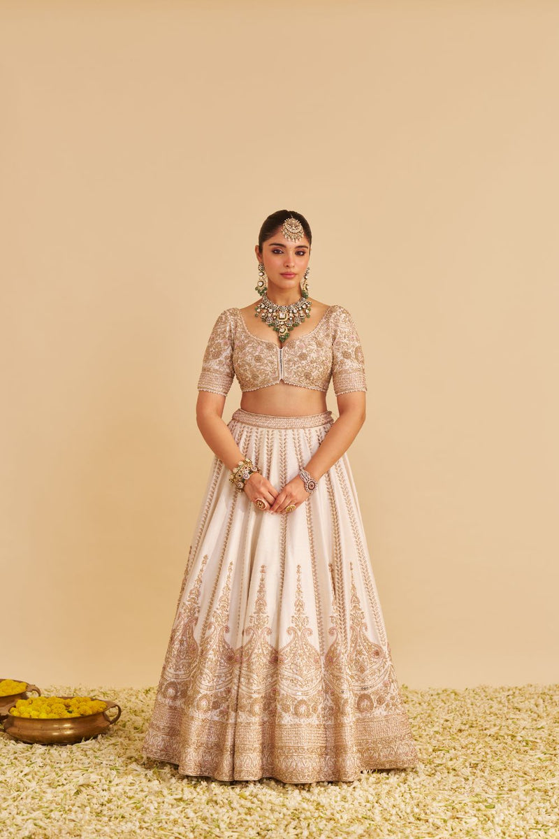 Farah - Dabka Zardozi Embroidered Pure Silk Daisy Ivory Lehenga Set silk by SHEETAL BATRA in blush color for women Worldwide
