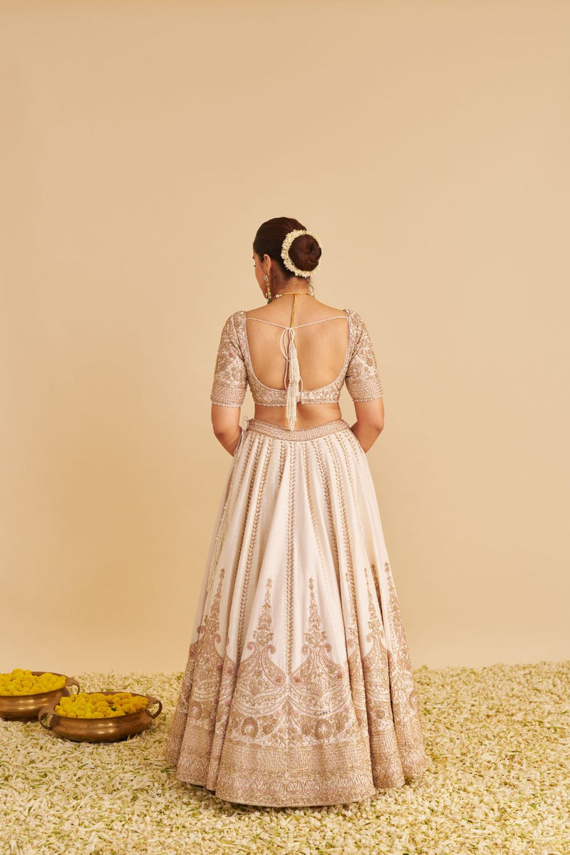 Farah - Dabka Zardozi Embroidered Pure Silk Daisy Ivory Lehenga Set silk by SHEETAL BATRA in blush color for women Worldwide