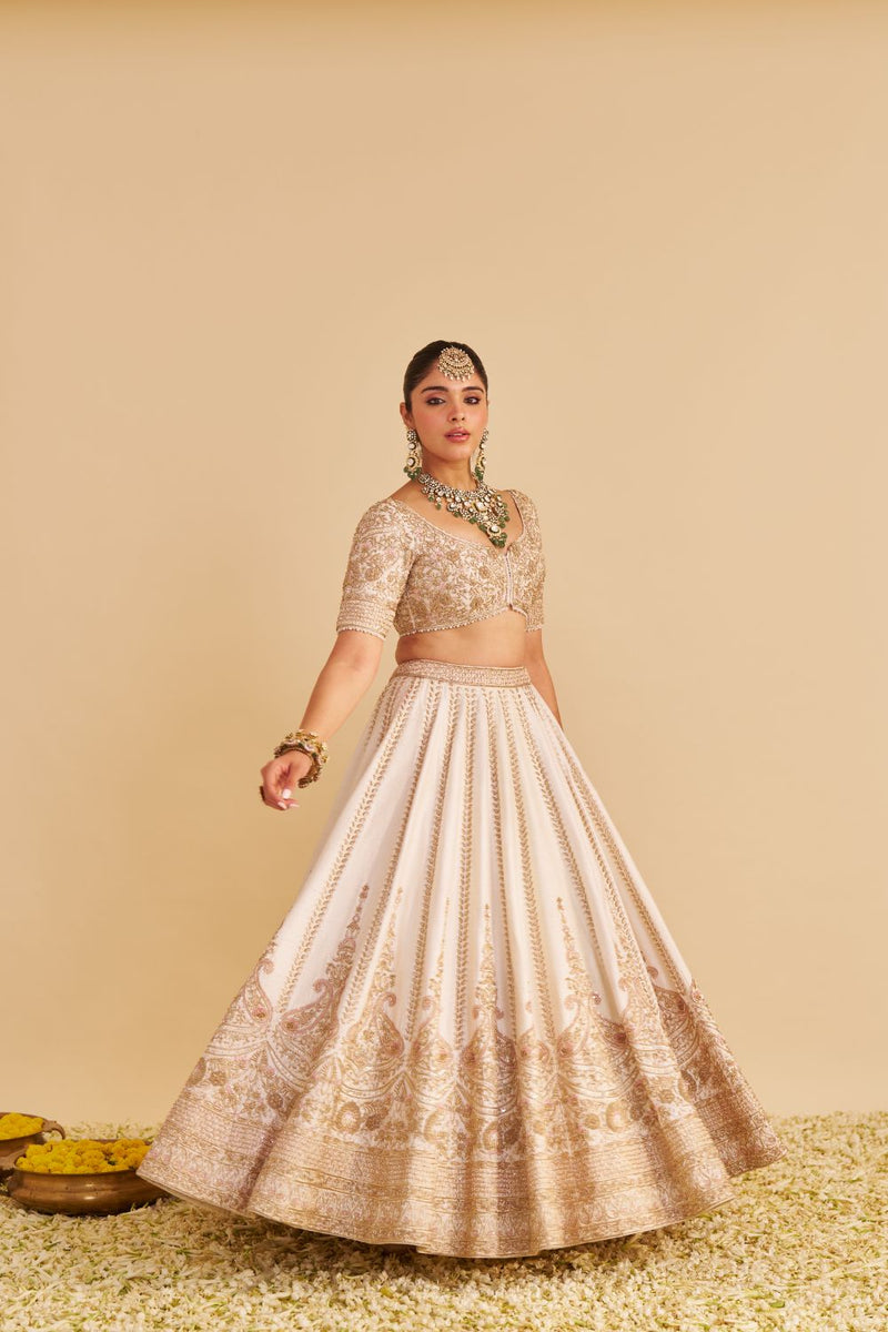 Farah - Dabka Zardozi Embroidered Pure Silk Daisy Ivory Lehenga Set silk by SHEETAL BATRA in blush color for women Worldwide
