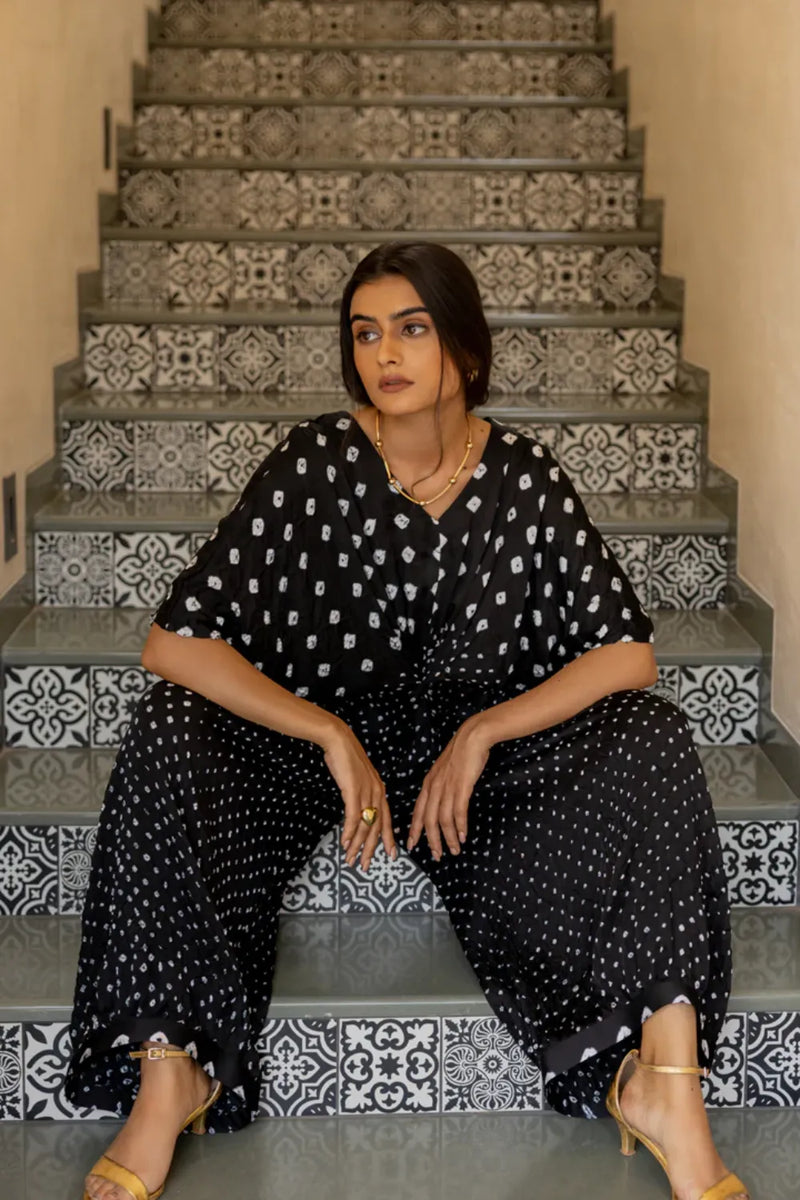 KNOT JUMPSUIT-BLACK silk by Dyelogue in black color for women Worldwide