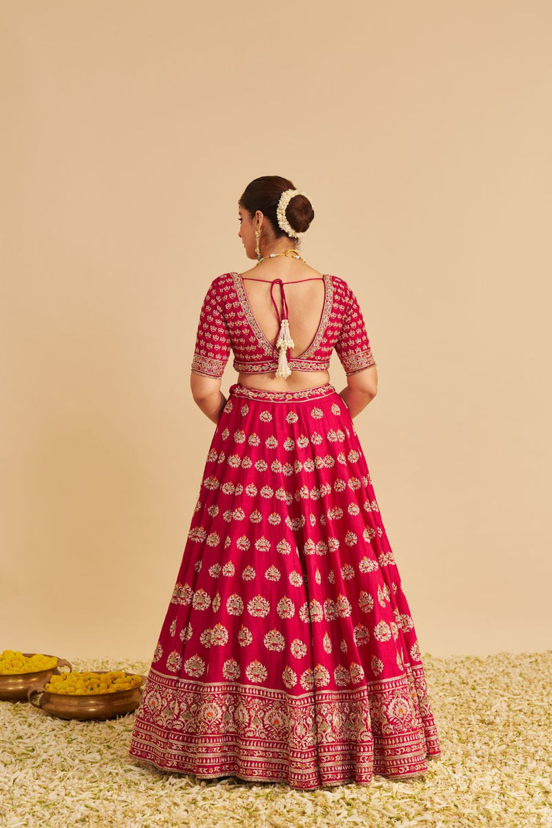 Maira - Dabka Zardozi Embroidered Raw Silk Hotpink Bridal Lehenga Set silk by SHEETAL BATRA in pink color for women Worldwide