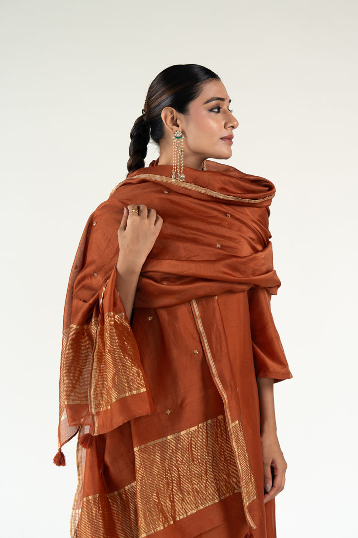 Gulzar Kurta Set with 
Ayra Odhani-Rust silk by Nirjara in rust color for women Worldwide