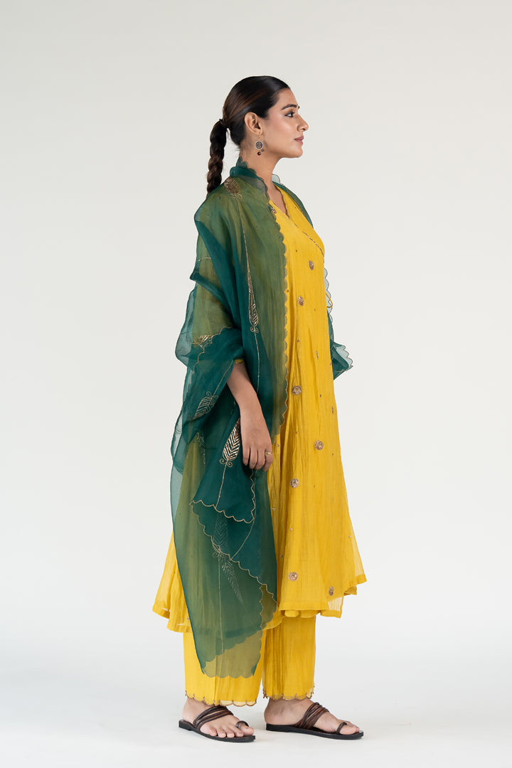 Yellow Angarkha Set
with Shama Odhani-Mustard & Emerald chanderi by Nirjara in yellow color for women Worldwide