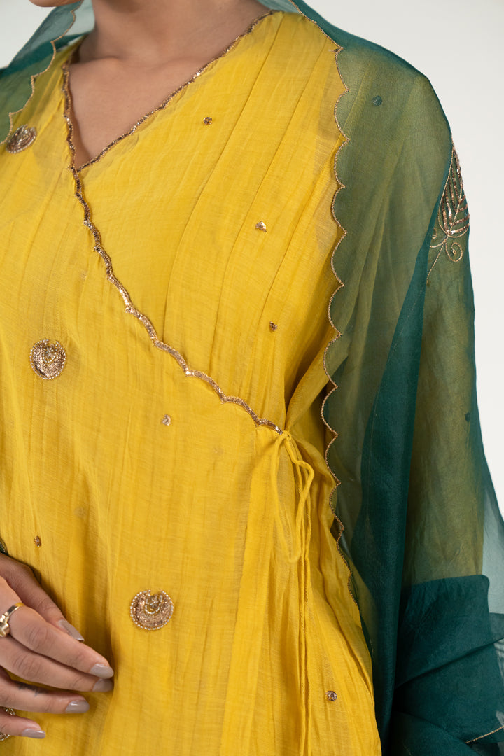 Yellow Angarkha Set
with Shama Odhani-Mustard & Emerald chanderi by Nirjara in yellow color for women Worldwide