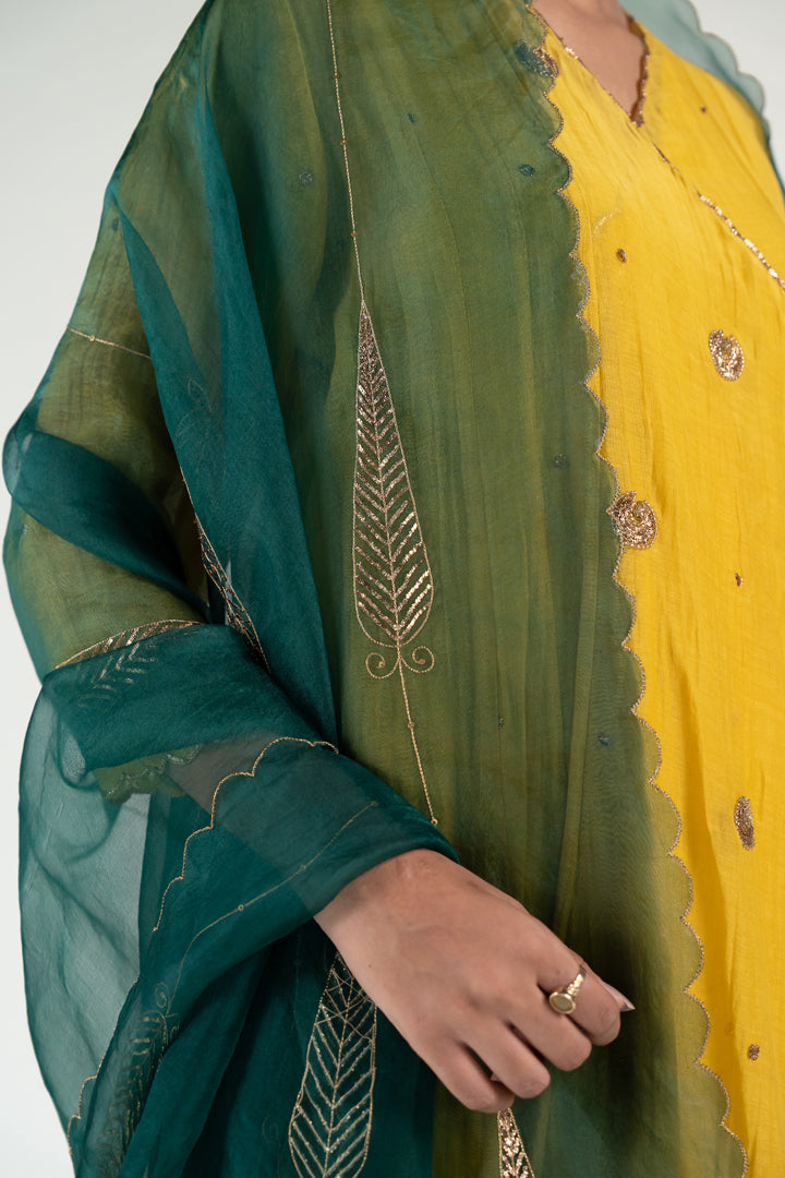 Yellow Angarkha Set
with Shama Odhani-Mustard & Emerald chanderi by Nirjara in yellow color for women Worldwide